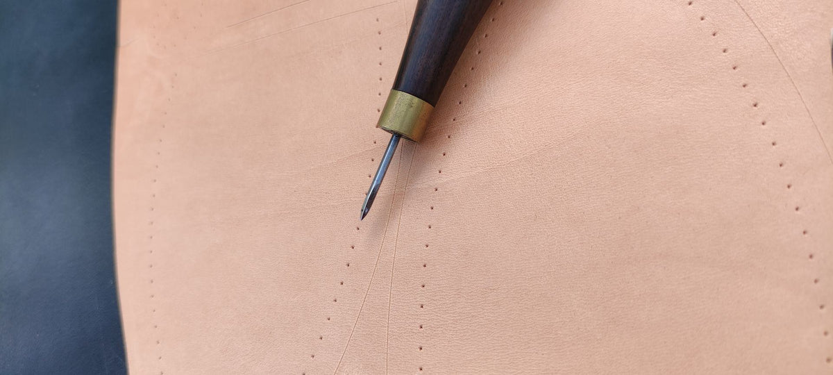 Stitching awl on natural leather